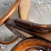 Warm walnut bentwood and cane child's rocking chair early 20th-century