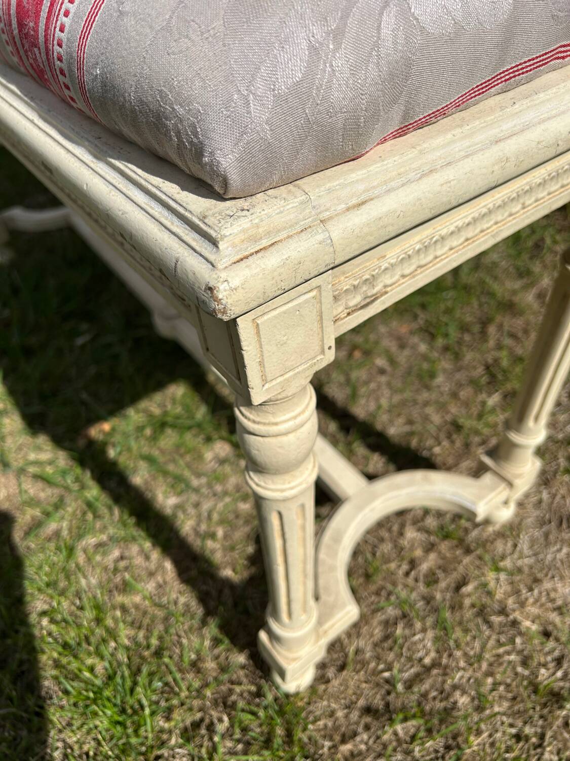 Louis XVI style bench at the end of the bed