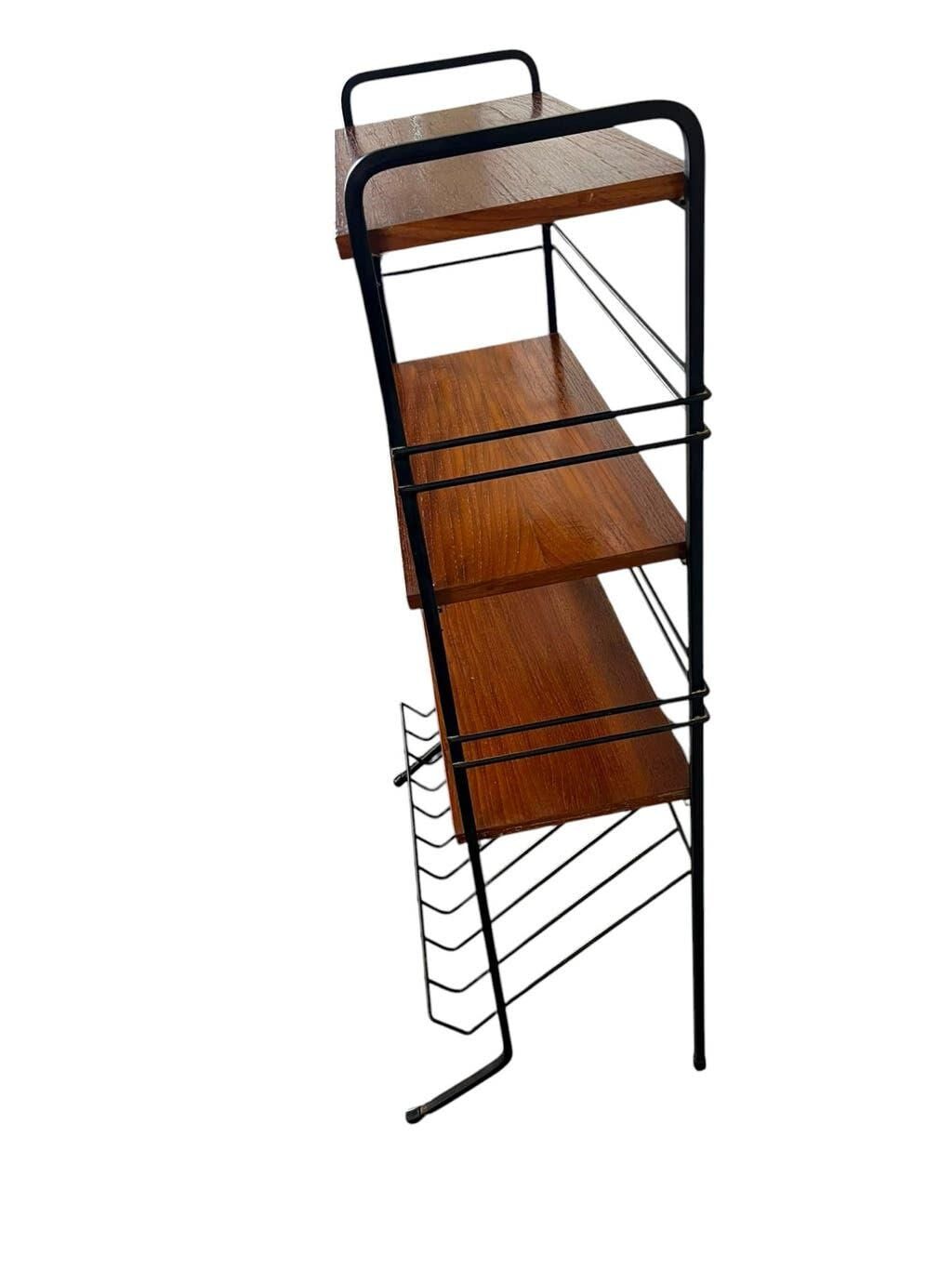 Vintage black shelf/coat rack with wooden accents.