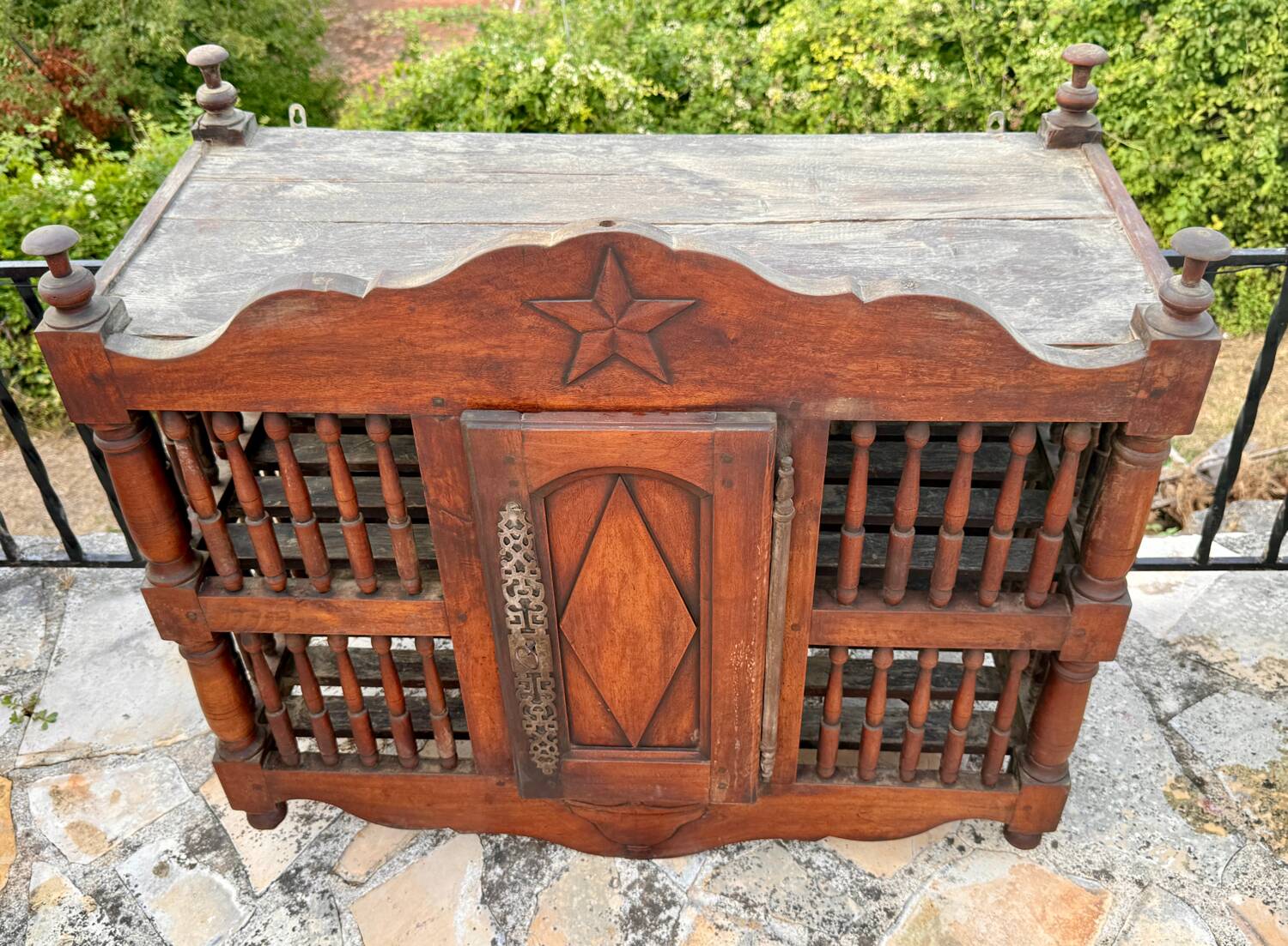 Molded and carved walnut panetière, 19th century.