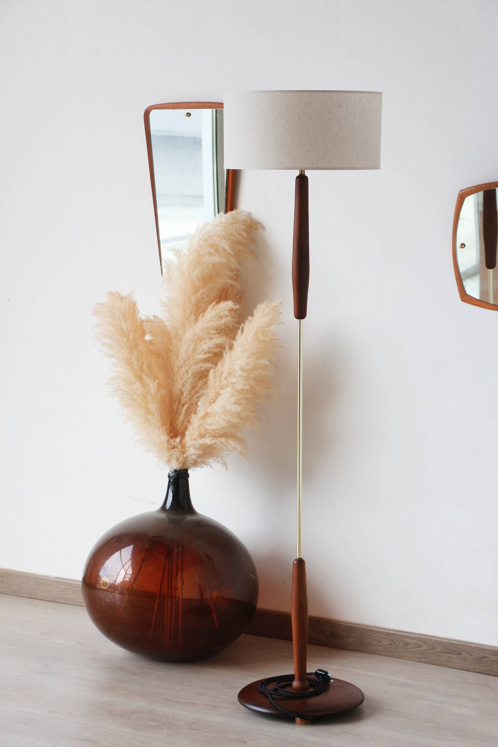Vintage floor lamp in teak and brass with a cream shade.