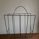 Mid-century poetic magazine rack in black metal