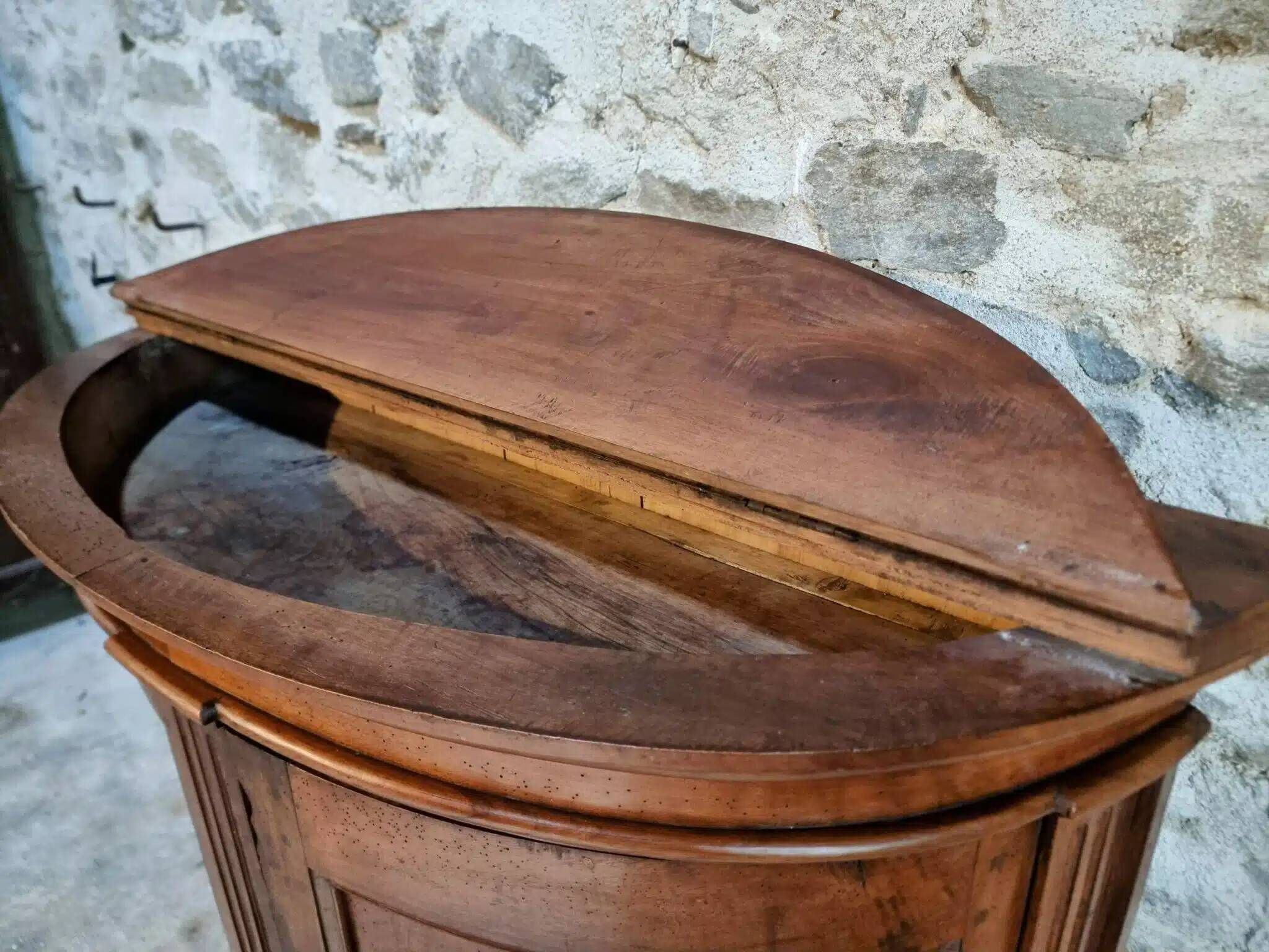 Antique demi-lune cabinet in walnut, late 18th century, French château.