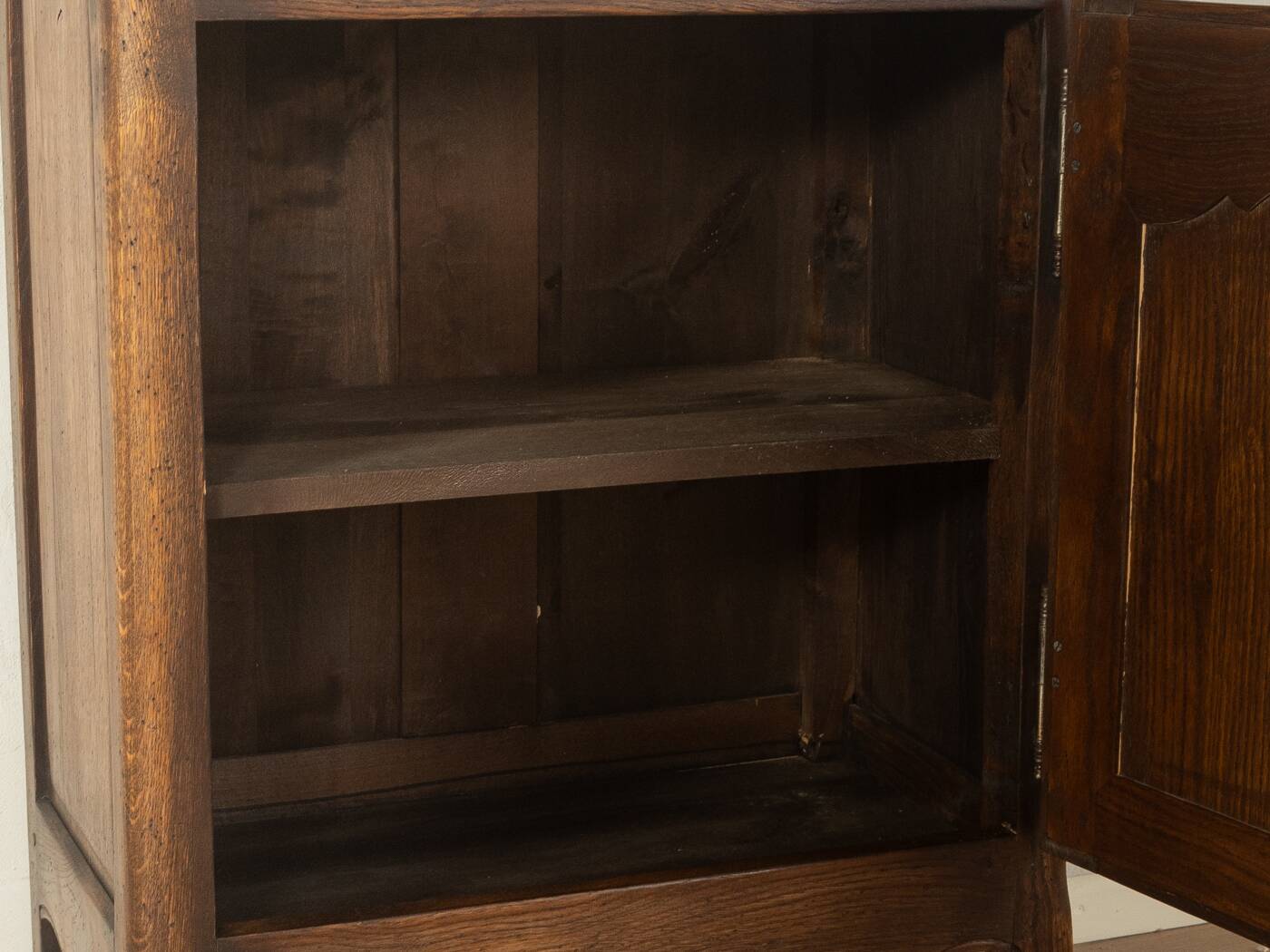 Antique chest of drawers with curved silhouette and patina