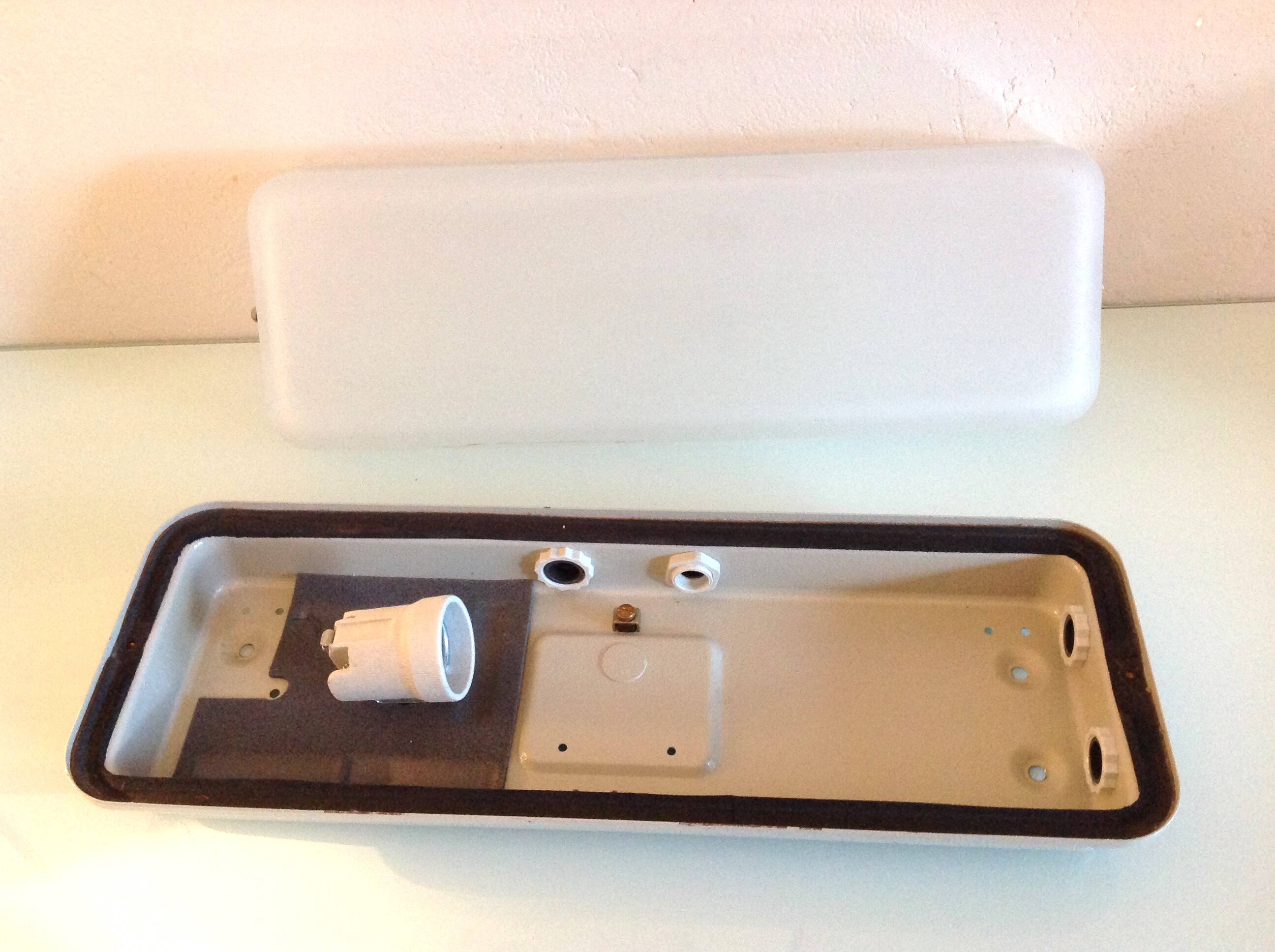 Rectangular porthole wall light in industrial/70s style frosted glass