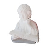 Plaster bust reading child