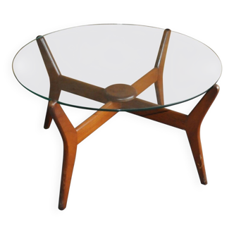 Mid-century coffee table in brown teak with a floating tempered glass top.