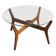 Mid-century coffee table in brown teak with a floating tempered glass top.