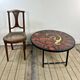 Vintage round coffee table in graphic red and yellow ceramic from the 1960s.