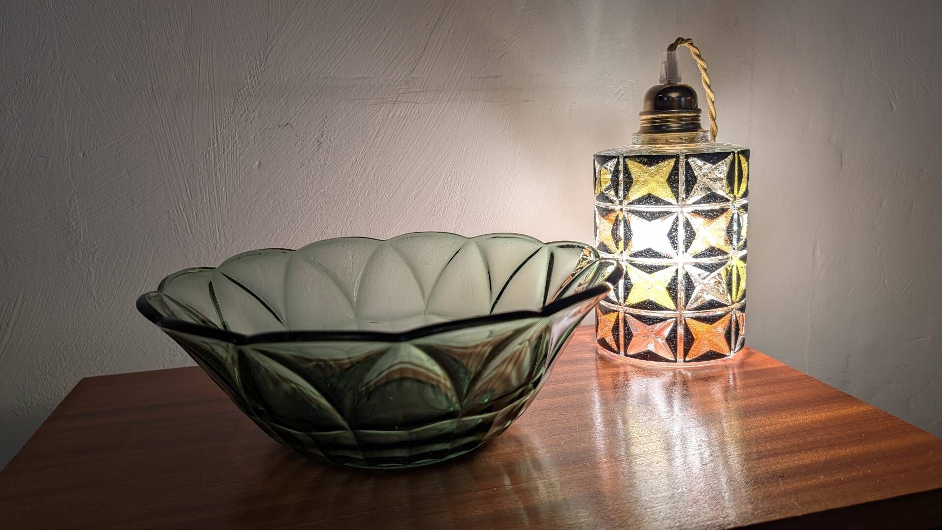 Vintage green smoked glass coupe with geometric decoration.