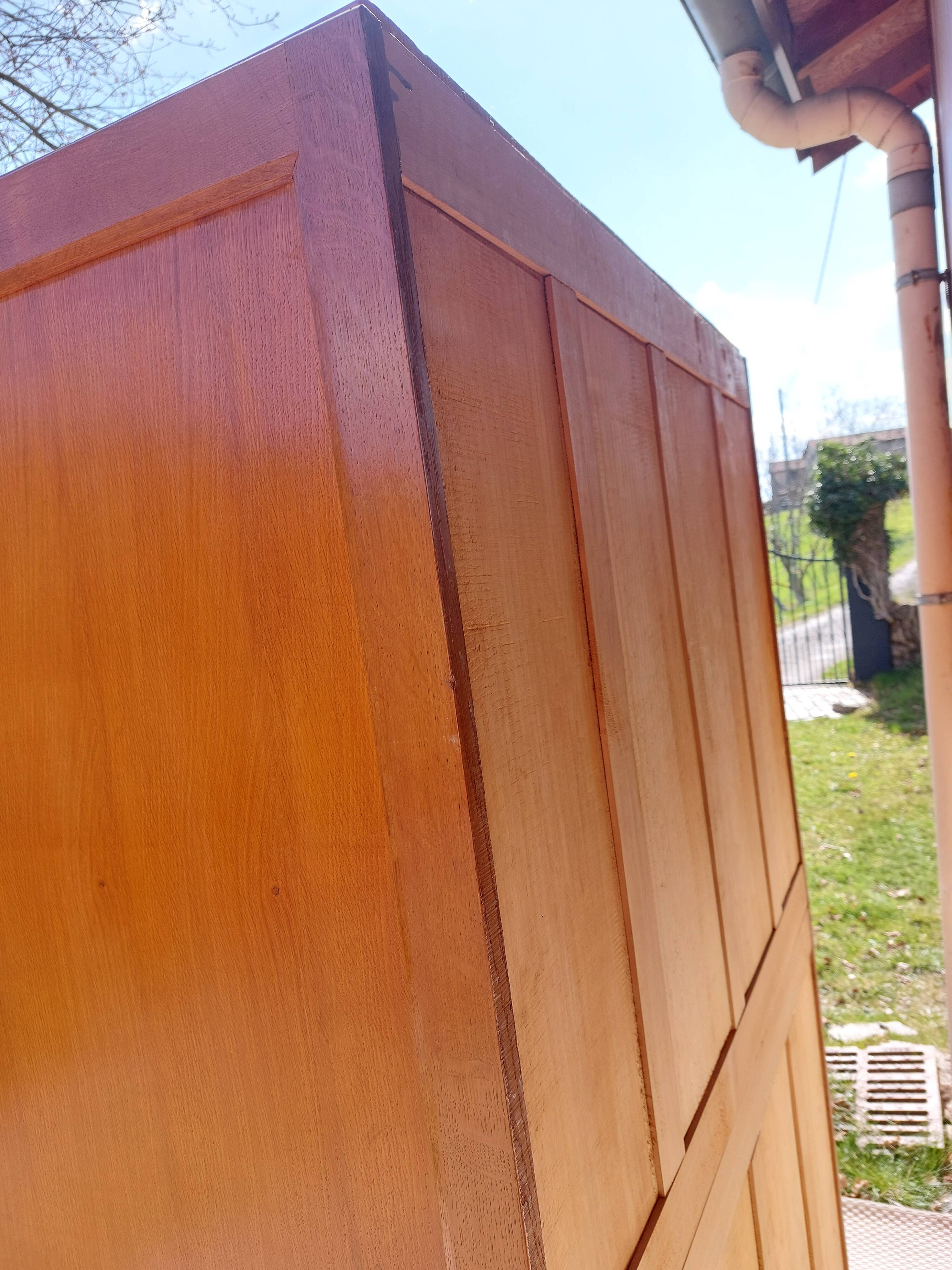 Vintage wardrobe with mirror and tapered legs.
