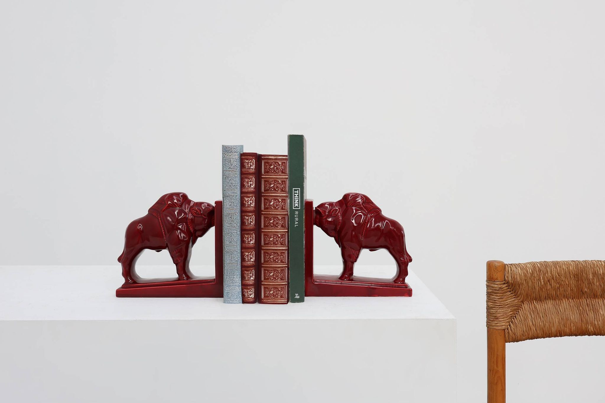 Pair of red glazed ceramic Bison ox bookends in Art Deco style, Belgium