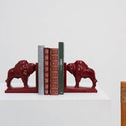 Pair of red glazed ceramic Bison ox bookends in Art Deco style, Belgium