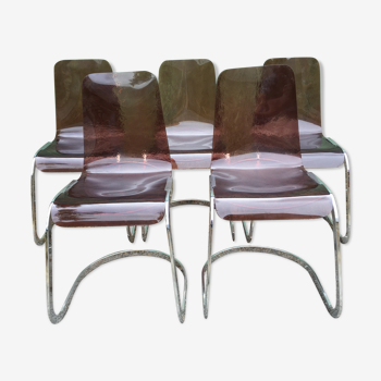 Chaises design vintage à assises en plexiglas à piétement en métal chromé