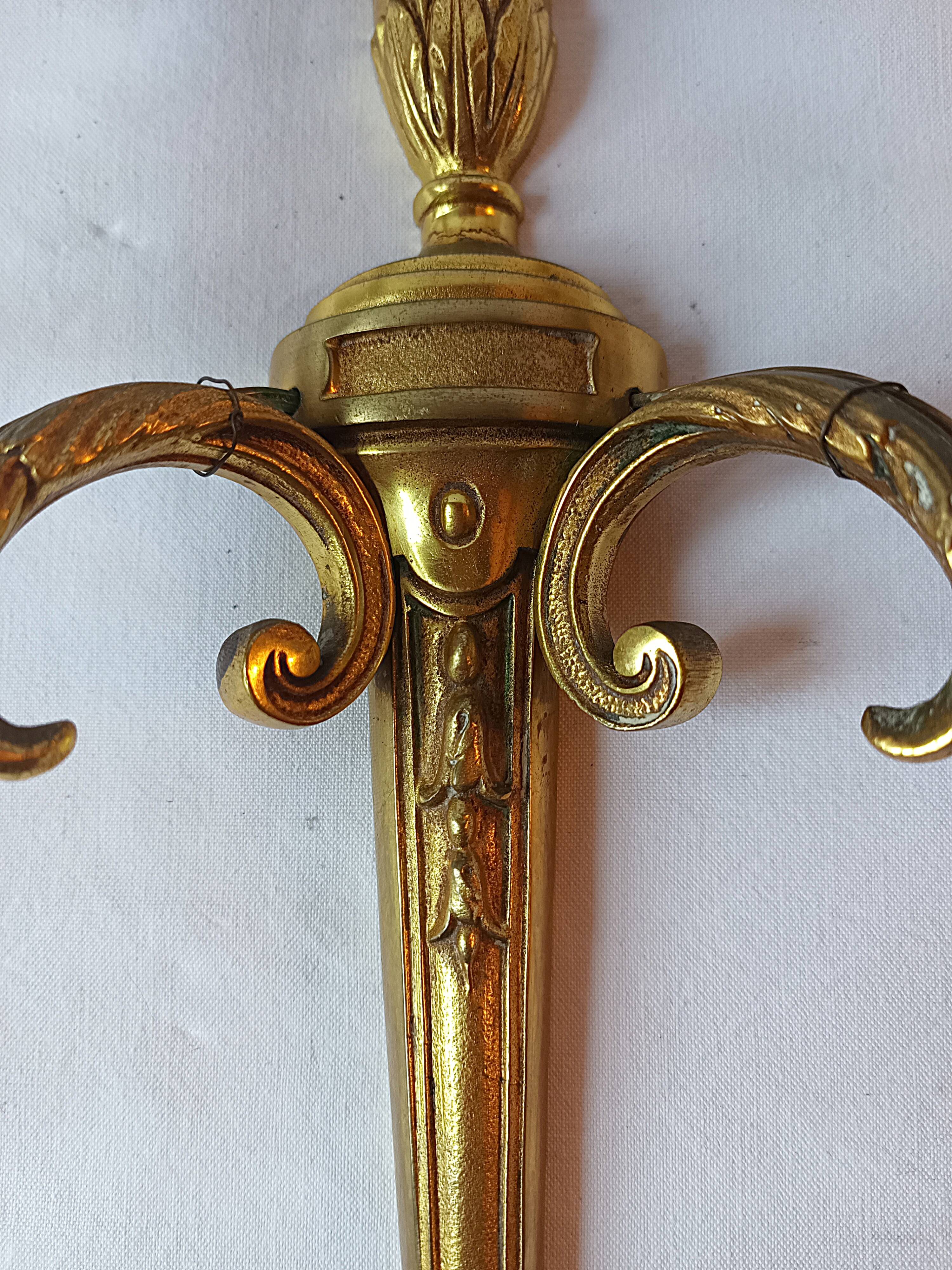 Pair of bronze wall sconces in Louis XVI style