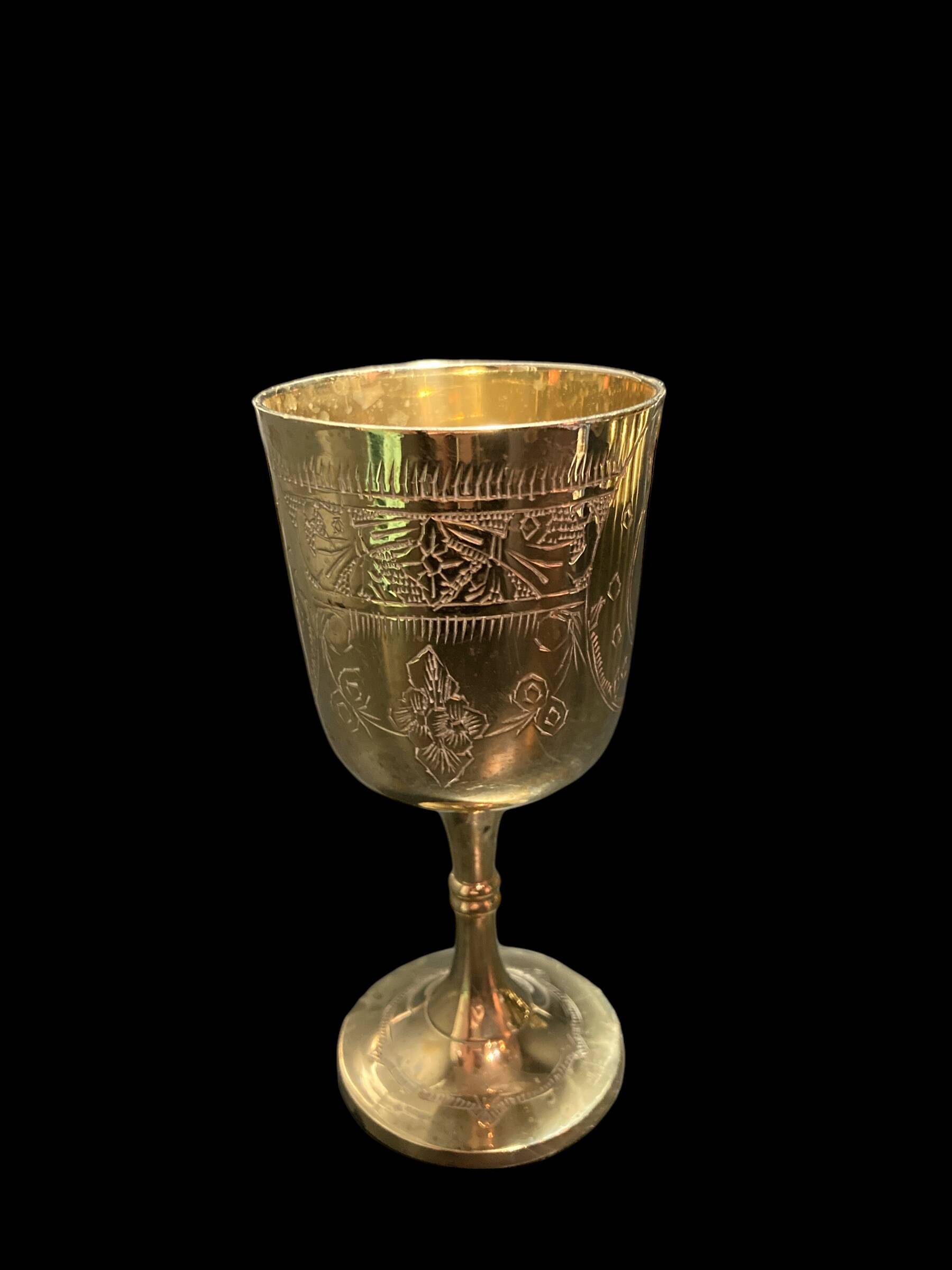 Set of six gold metal glasses