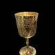 Set of six gold metal glasses