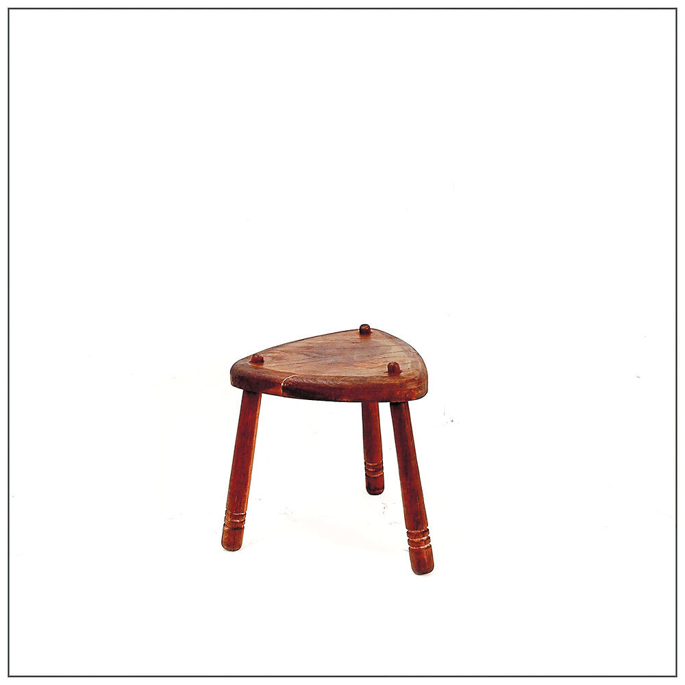 Rustic tripod stool with a triangular seat, 1960s.