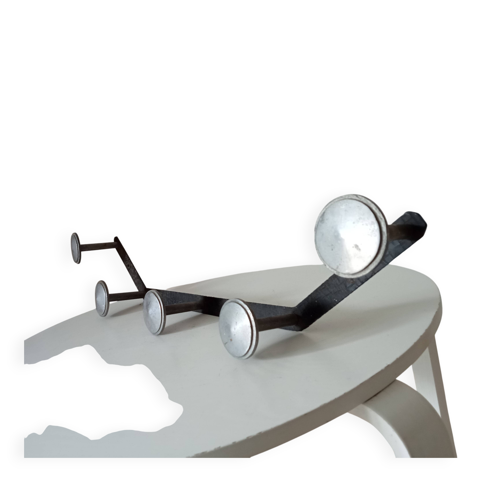 Vintage 1950s wall coat rack, wrought iron with chiselled details and solid aluminium.