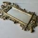 Mirror with cherub head in gilded wood, Venetian baroque style