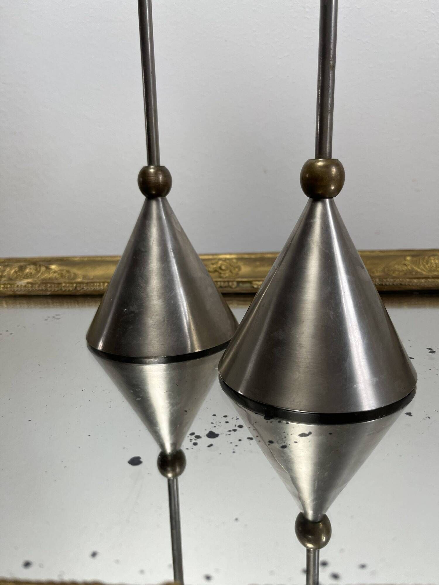 Pair of high vintage metal and brass candlesticks