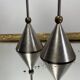 Pair of high vintage metal and brass candlesticks