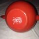 Small red metal teapot