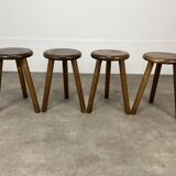 4 wooden tripod stools