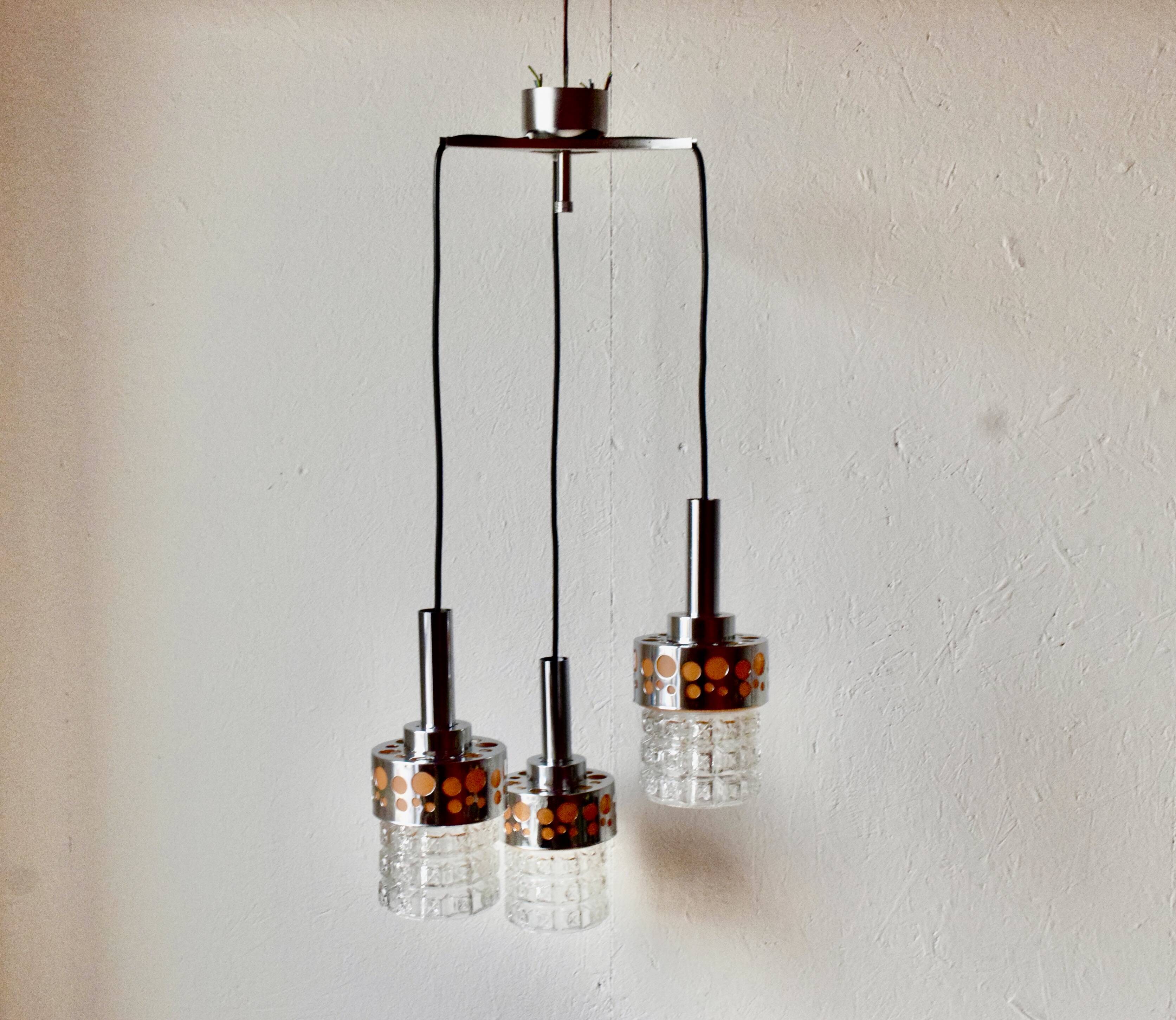 Triple vintage pendant light in molded glass, chrome metal and orange plastic - Space Age Design