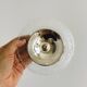 Bowl on a foot in worked glass and elegant metal