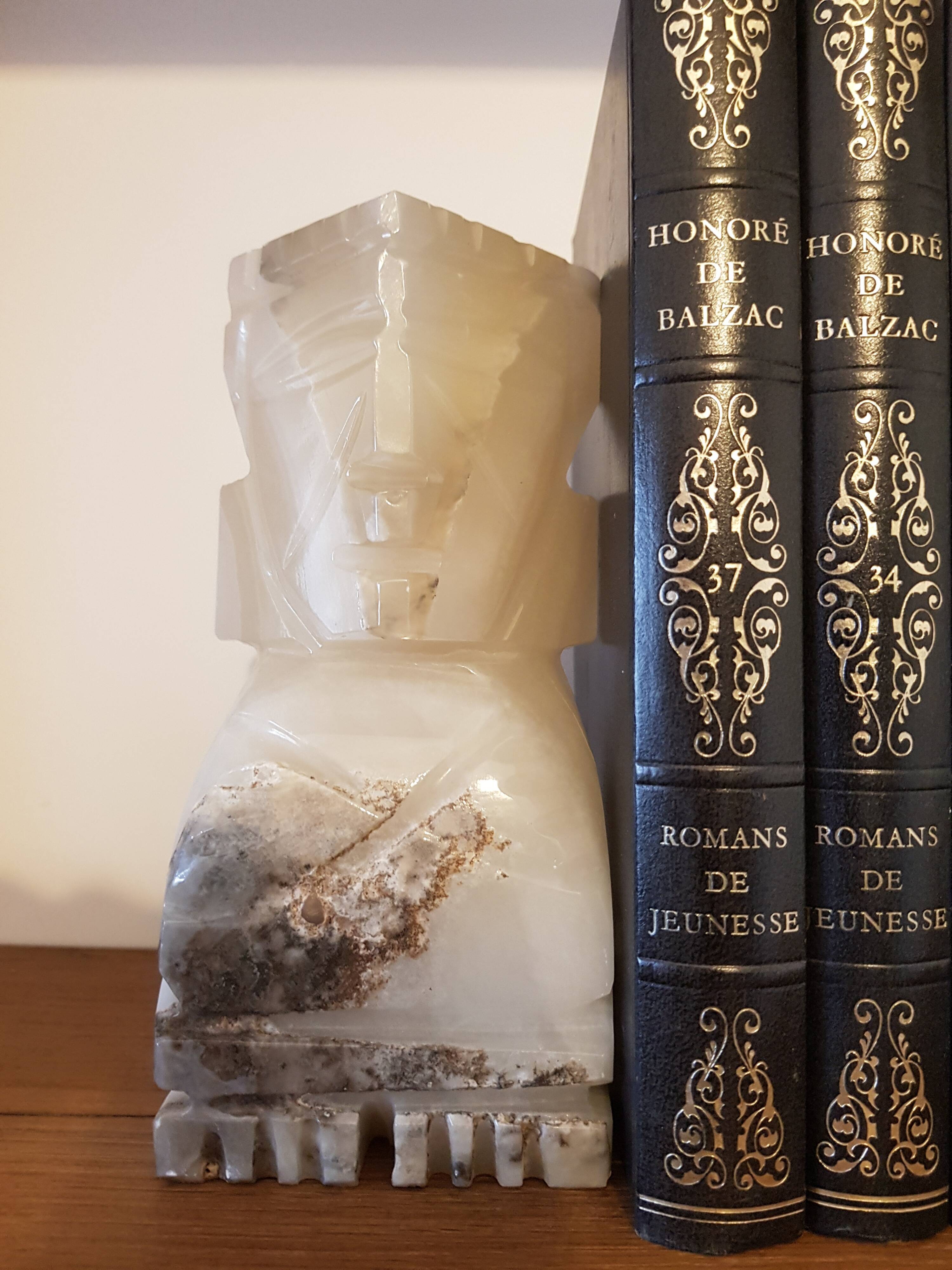 Onyx book clambands depicting an Aztec statue