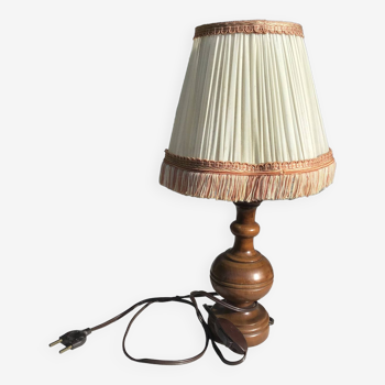 Turned wooden foot lamp with pleated lampshade