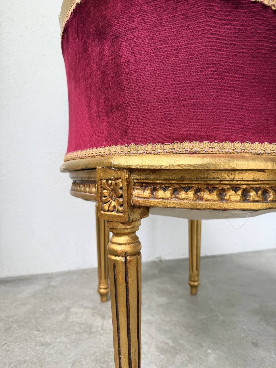 Louis XVI gilt wood and red velvet armchair