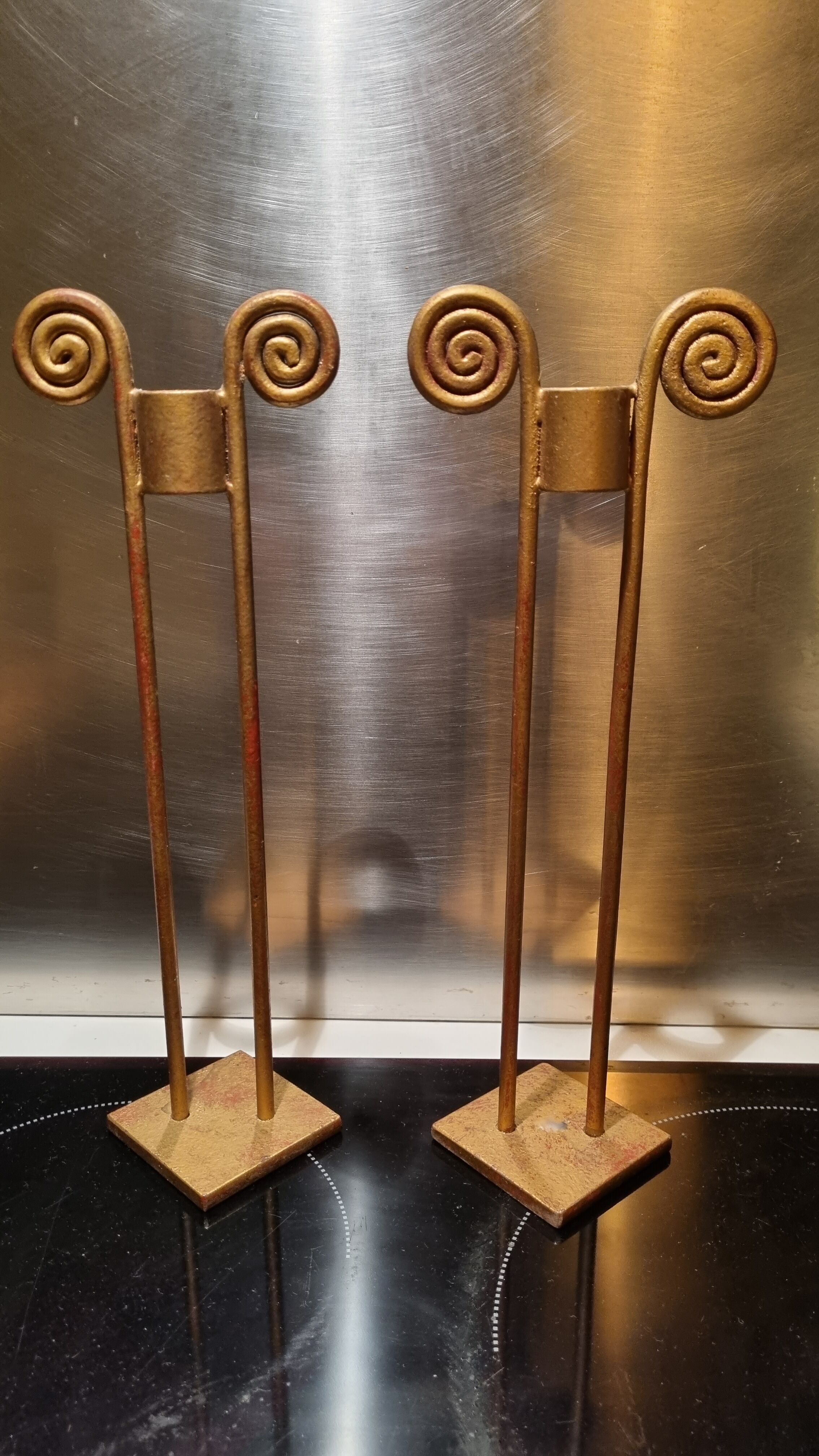 2 golden metal candlesticks