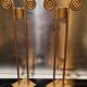 2 golden metal candlesticks
