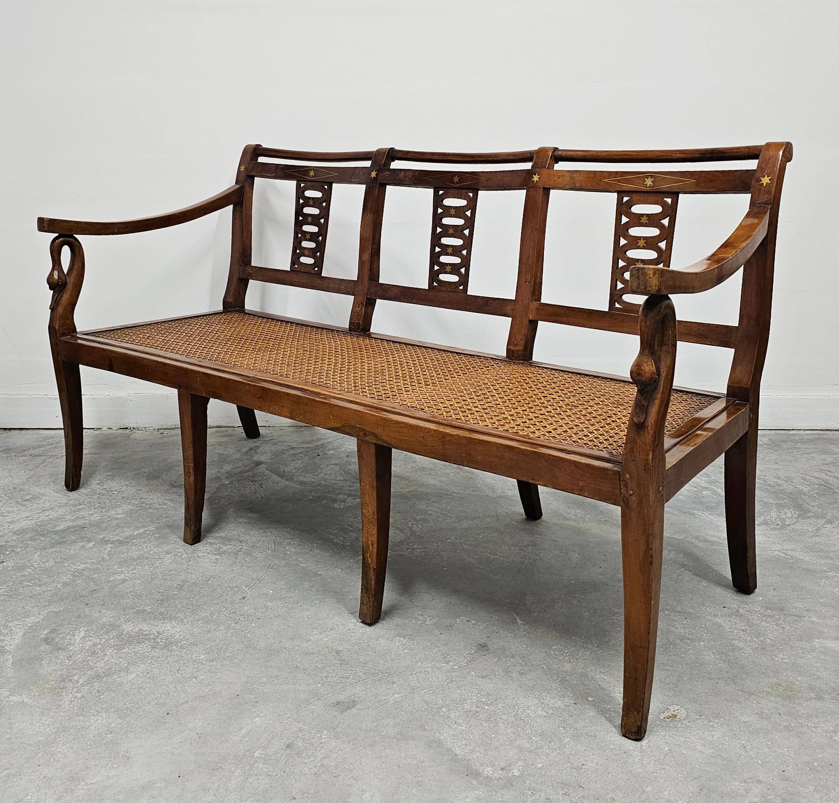 Directoire canapé in walnut with brass inlays, late 18th century.