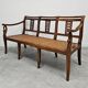 Directoire canapé in walnut with brass inlays, late 18th century.