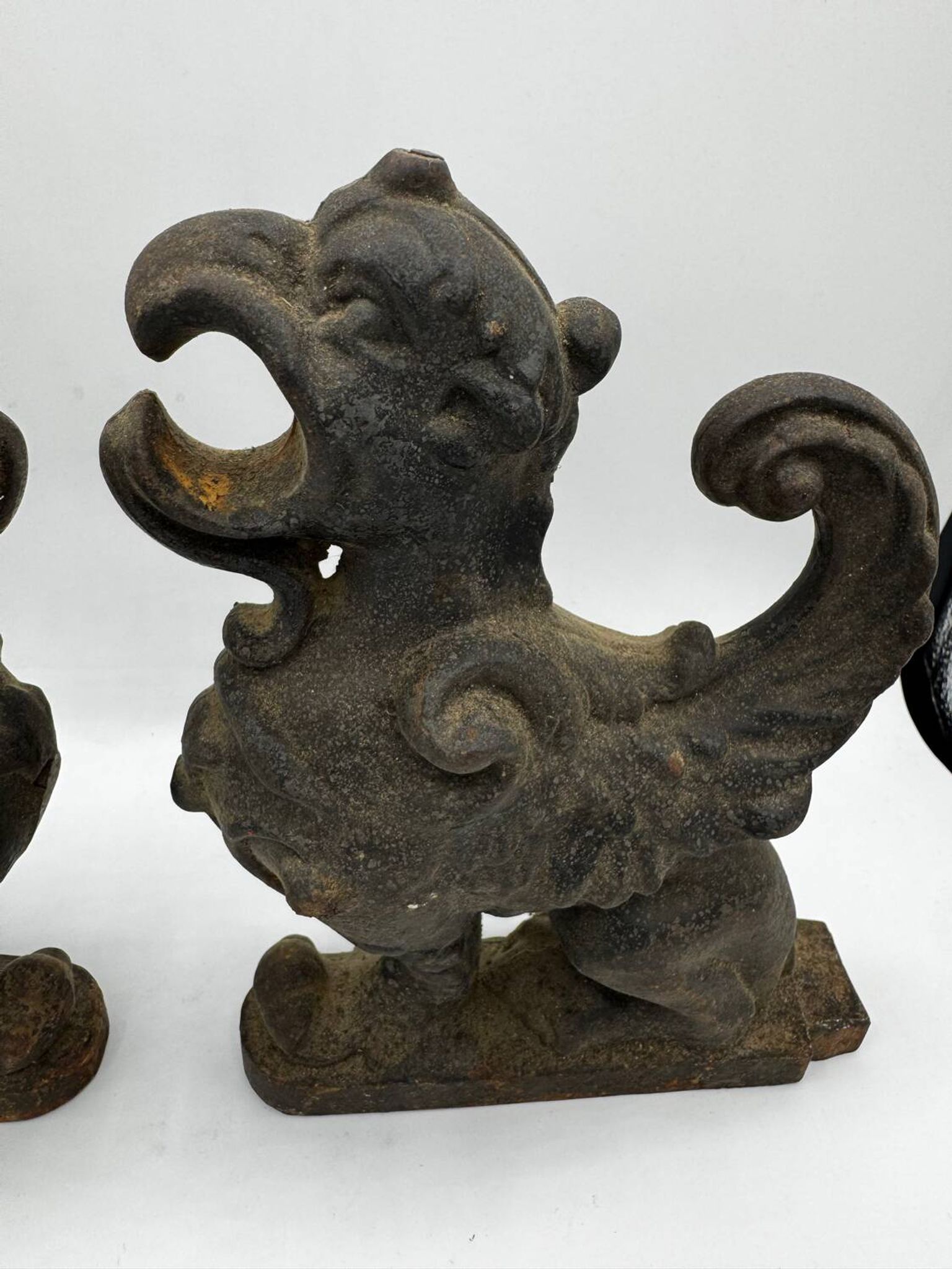 Pair of winged chimera and dragon fire dogs in cast iron