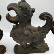 Pair of winged chimera and dragon fire dogs in cast iron