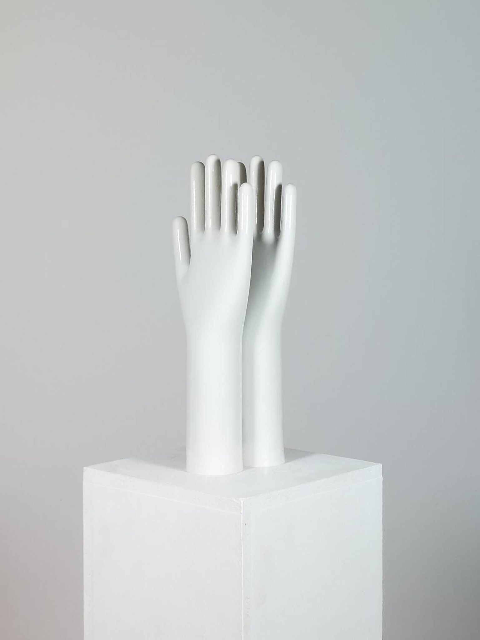 Pair of authentic vintage jewellery displays in industrial porcelain representing hands.