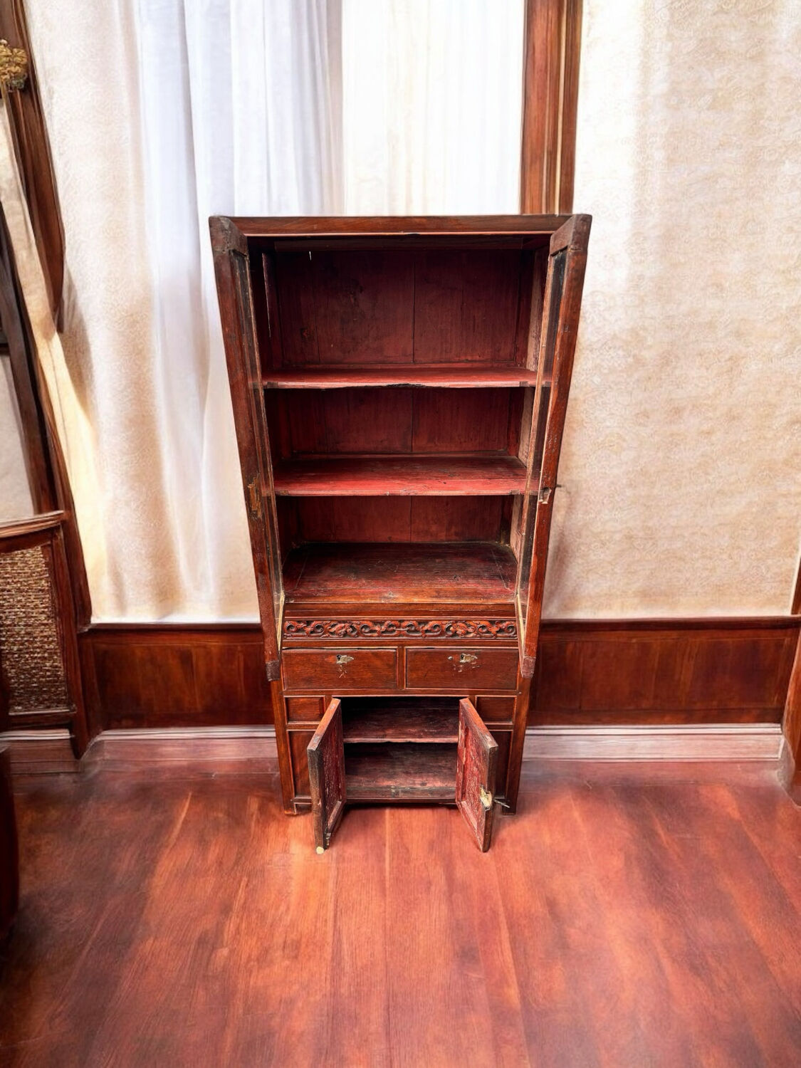 Attractive two-part Indochinese display cabinet. Mid-20th century