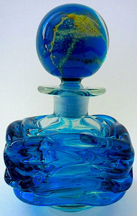 Blown blue glass bottle with inclusions