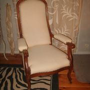 Armchair and its footrest