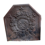 Old cast iron fireplace plate with lily flowers