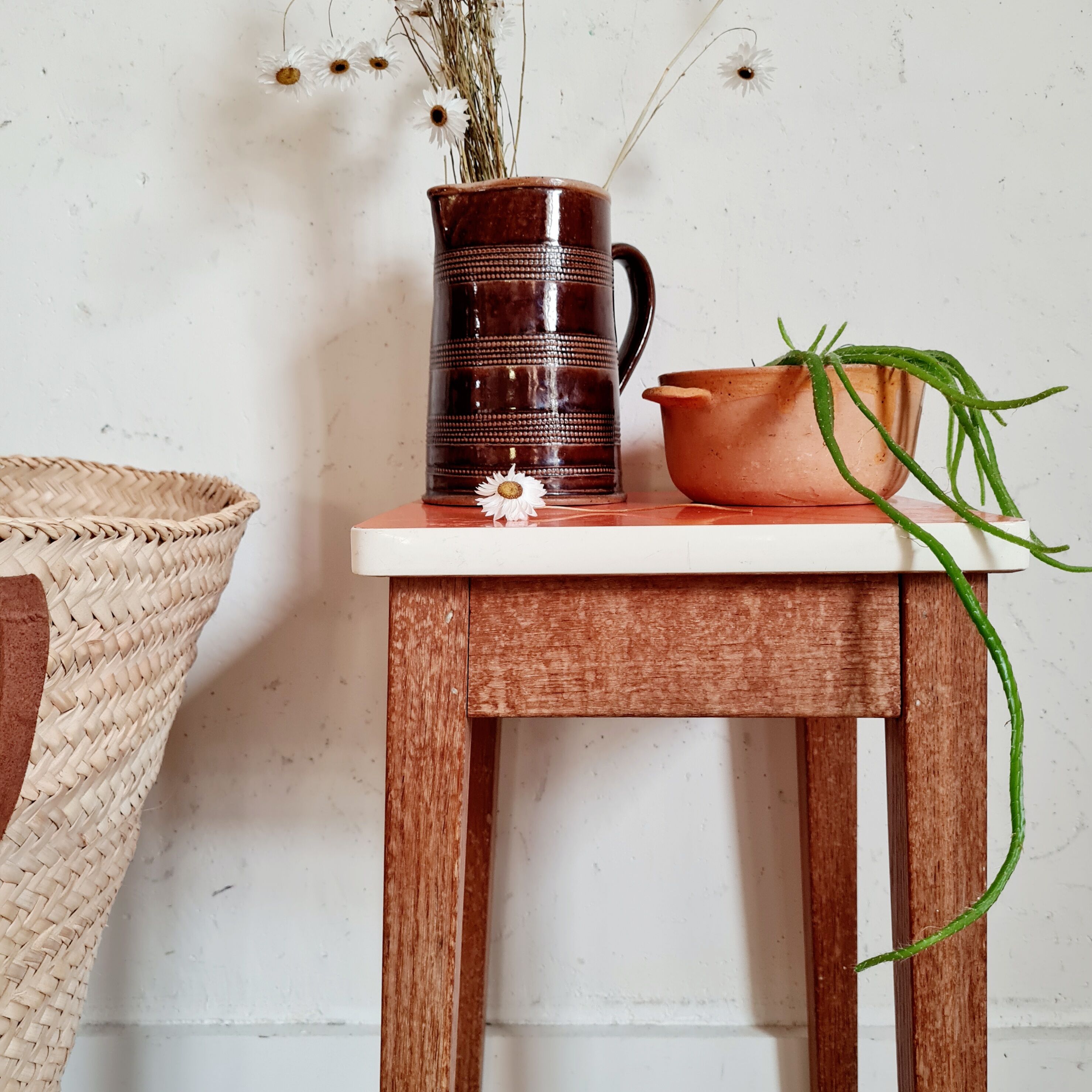 Wooden wax stool and orange formica