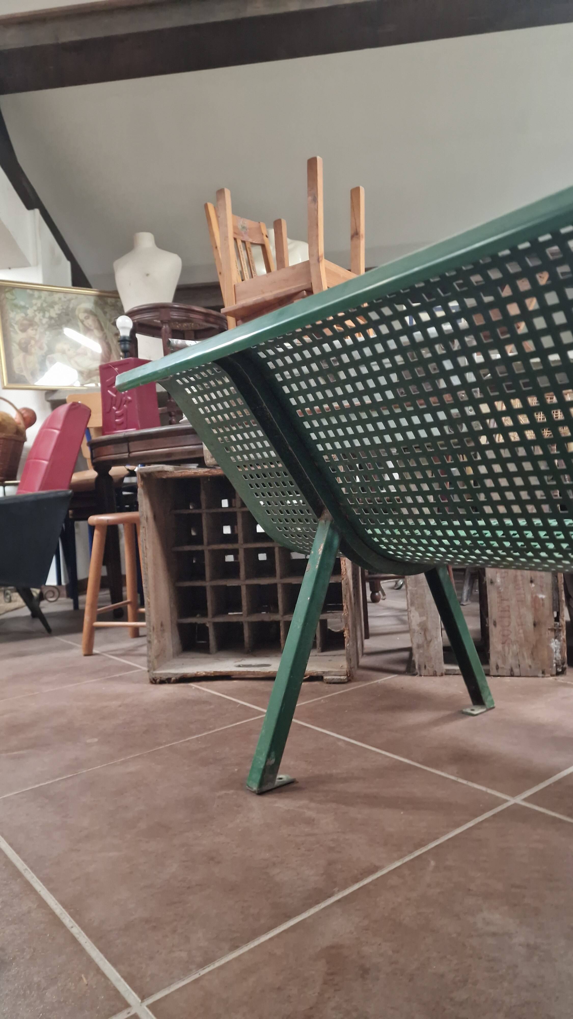 Vintage green perforated metal public bench