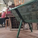 Vintage green perforated metal public bench