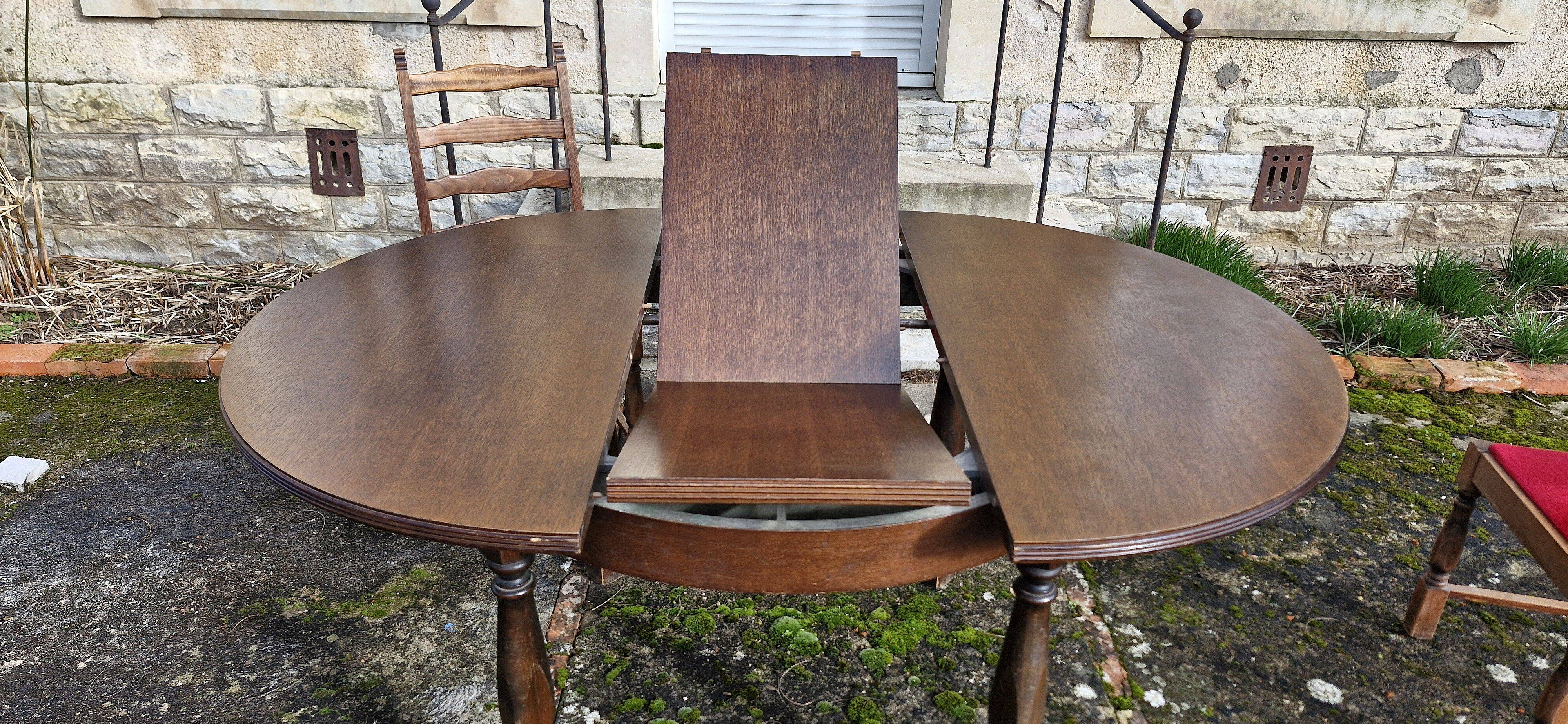 Round wooden table with 1 integrated extension + 6 wooden and fabric chairs