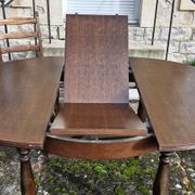 Round wooden table with 1 integrated extension + 6 wooden and fabric chairs