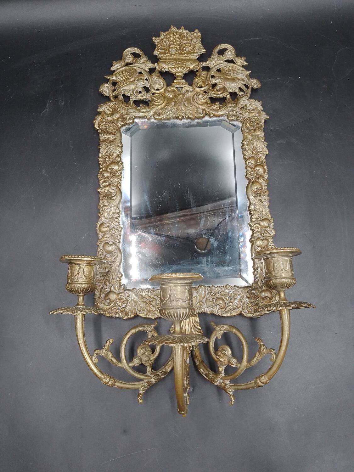 Repousse brass wall mirror with three candles, beveled glass, end of 19th century, double eagles